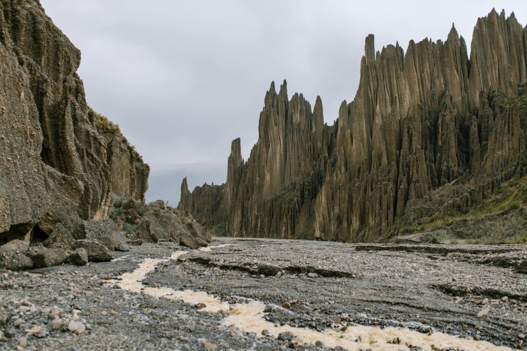 Dramatic cliff and rock formations create a breathtaking landscape in Bolivia.